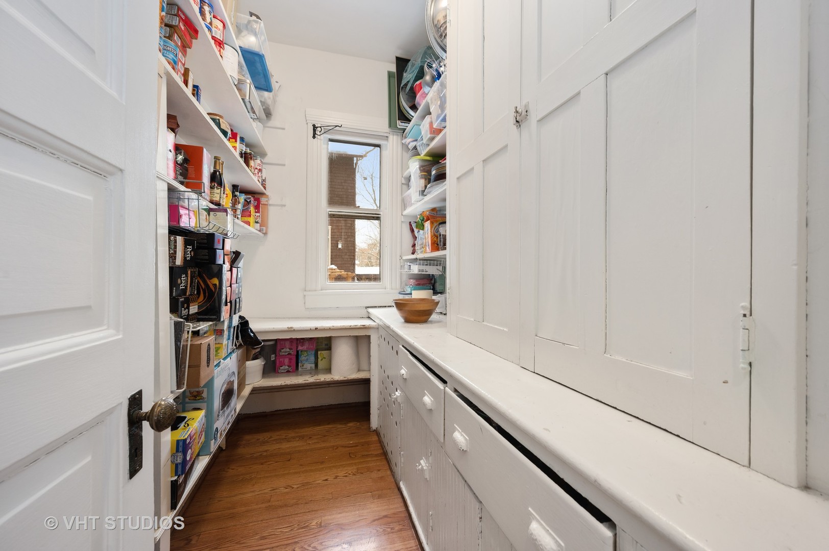 1031 Maple Avenue Evanston, IL 60202 - Photo 25 of 54 a hallway with cabinets and wooden floor