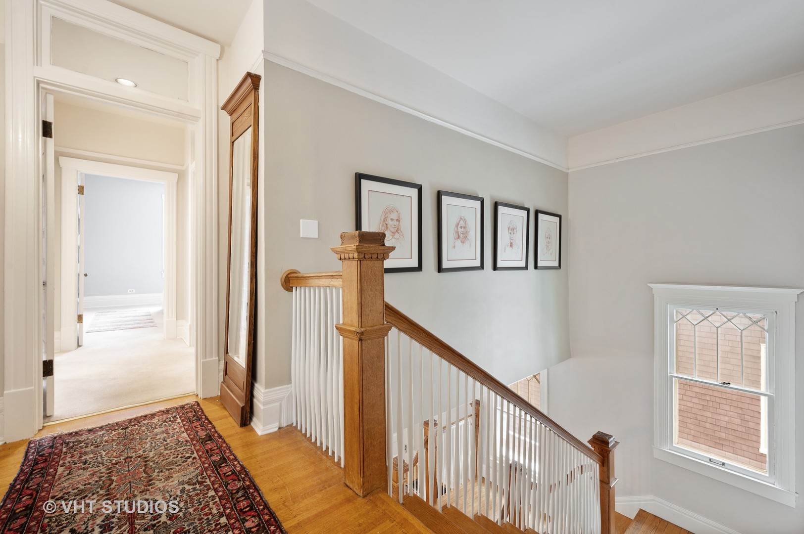 1031 Maple Avenue Evanston, IL 60202 - Photo 26 of 54 a view of a hallway with wooden floor and stairs