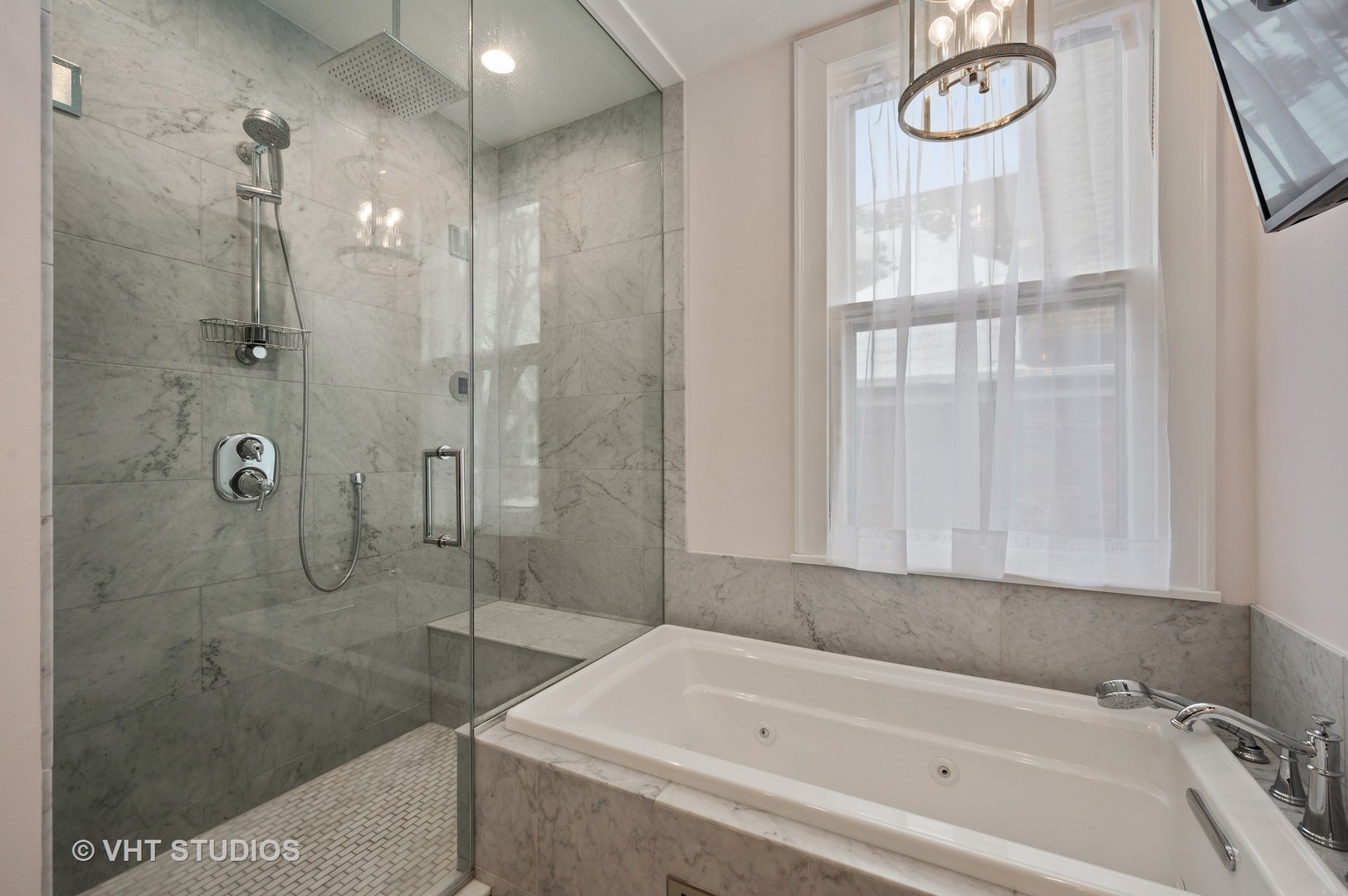 1031 Maple Avenue Evanston, IL 60202 - Photo 31 of 54 a bathroom with a bathtub and a shower