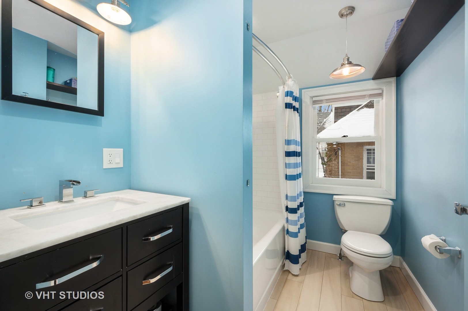 1031 Maple Avenue Evanston, IL 60202 - Photo 40 of 54 a bathroom with a sink a toilet and mirror