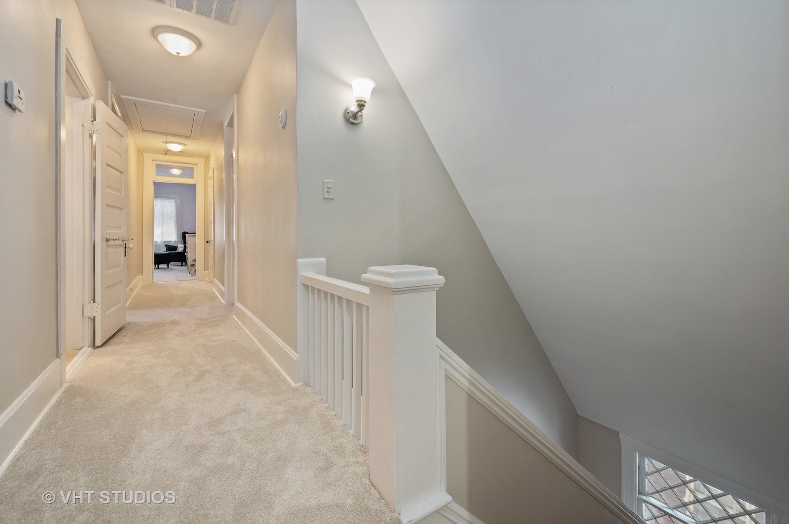 1031 Maple Avenue Evanston, IL 60202 - Photo 42 of 54 a view of a hallway with white walls and stairs