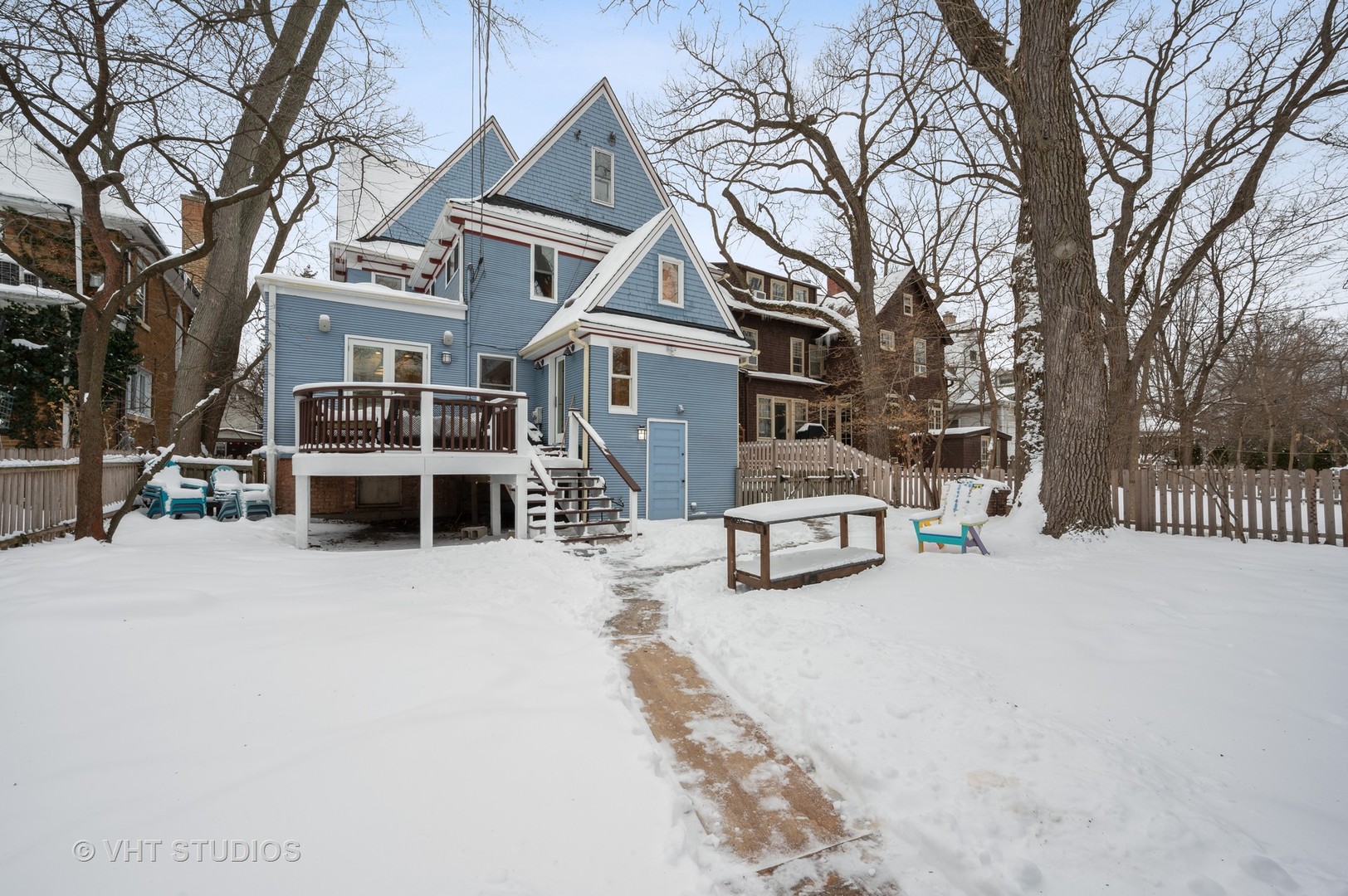 1031 Maple Avenue Evanston, IL 60202 - Photo 49 of 54 a view of a house with a yard covered in snow