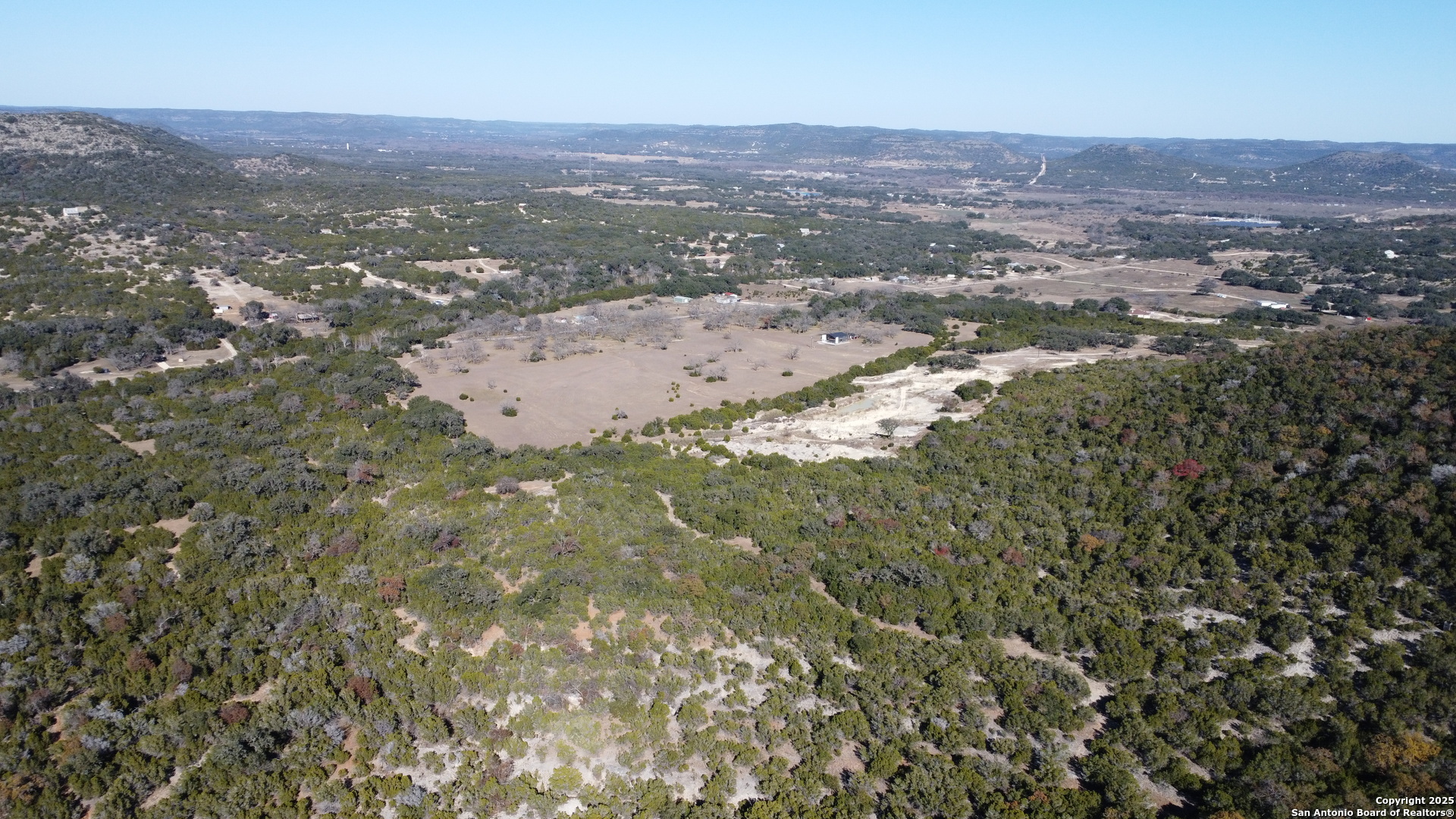 1611 Walter White Ranch Road Leakey, TX 78873 - Photo 6 of 8 an aerial view of residential houses with outdoor space and trees