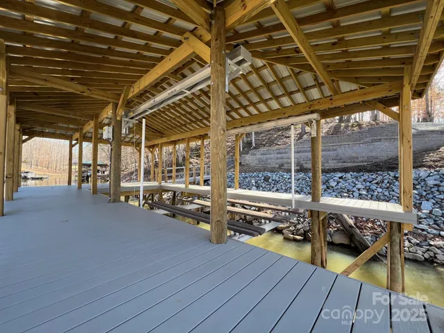 a view of a balcony with wooden floor