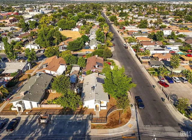 an aerial view of a residential houses with outdoor space