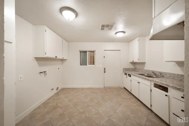 a large kitchen with cabinets