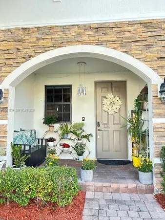 a front view of a house with outdoor seating