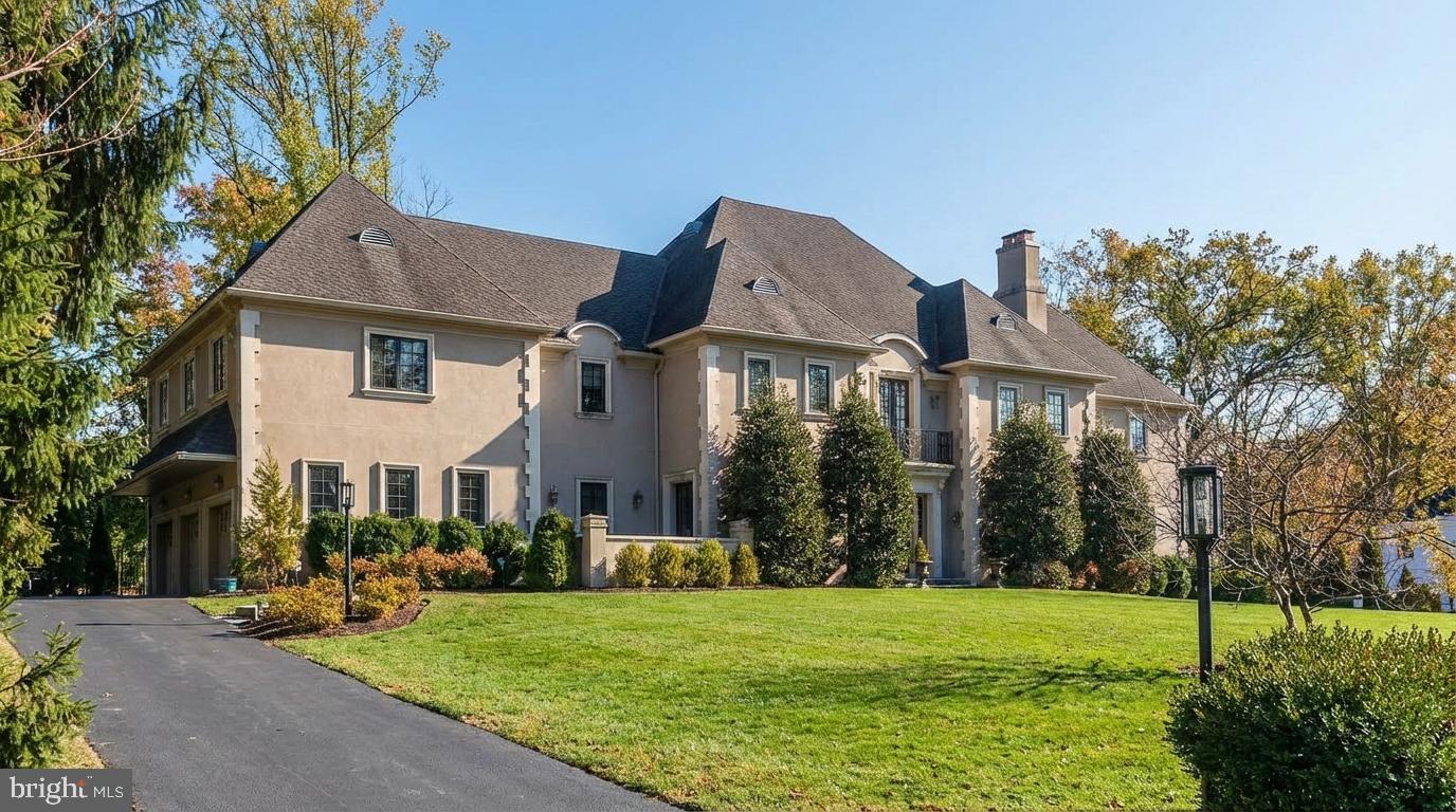 Elegant residence with lush landscaping.