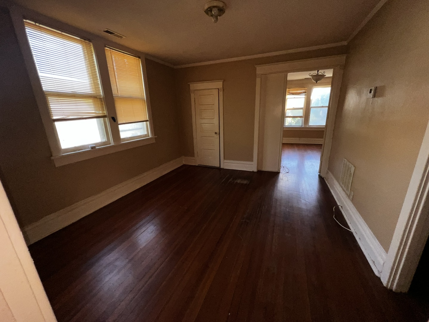 1511 Greenleaf Street Evanston, IL 60202 - Photo 16 of 37 a view of an empty room with wooden floor and a window