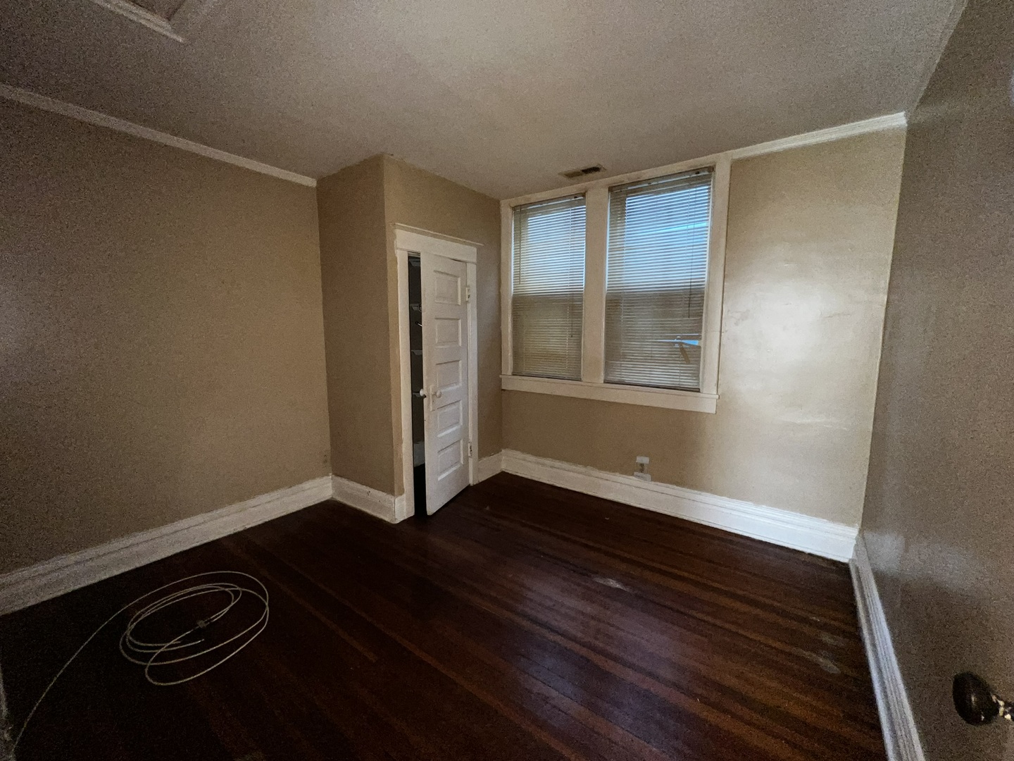 1511 Greenleaf Street Evanston, IL 60202 - Photo 17 of 37 a view of an empty room with wooden floor and a window