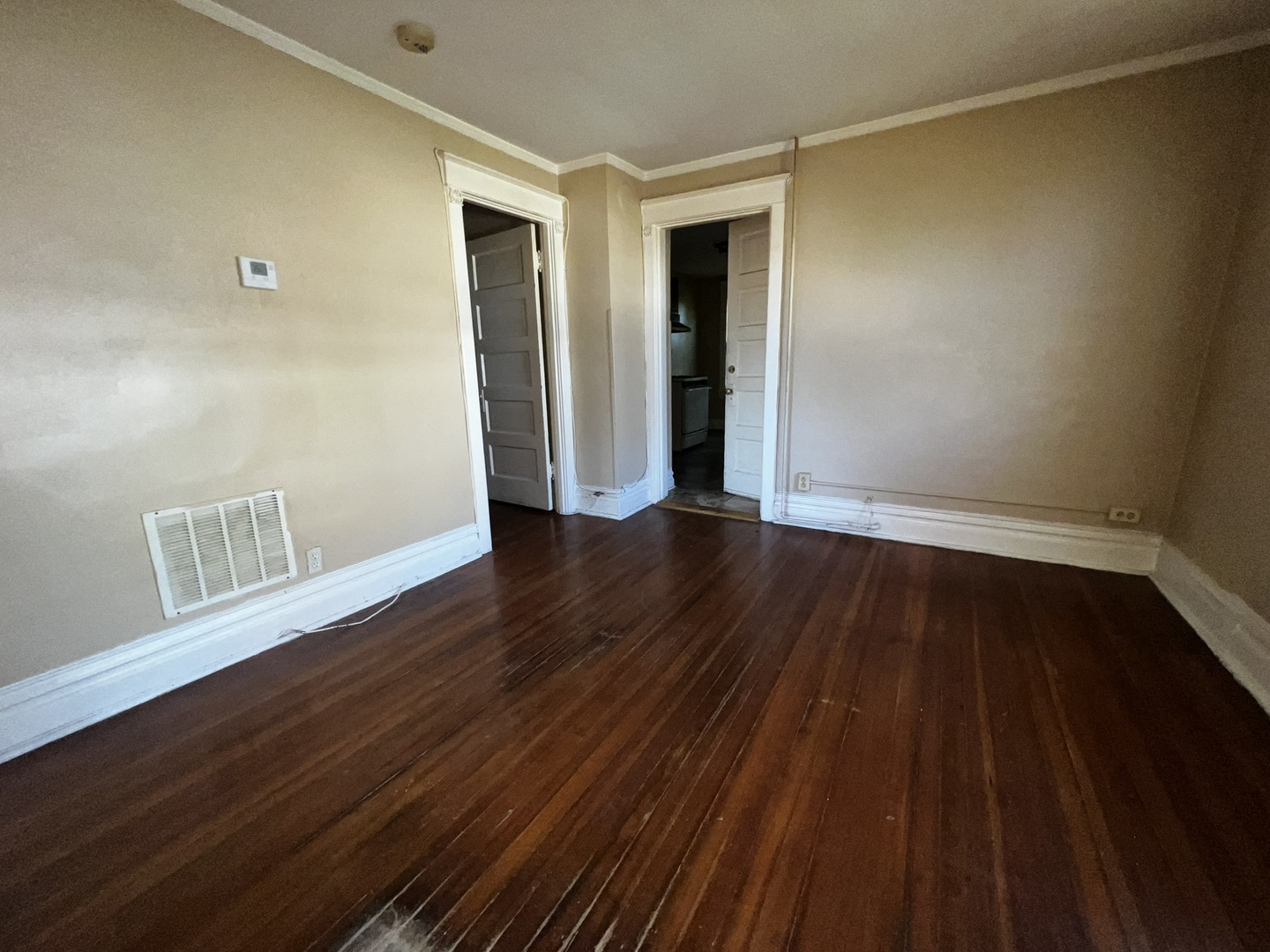 1511 Greenleaf Street Evanston, IL 60202 - Photo 21 of 37 a view of an empty room with wooden floor and a window