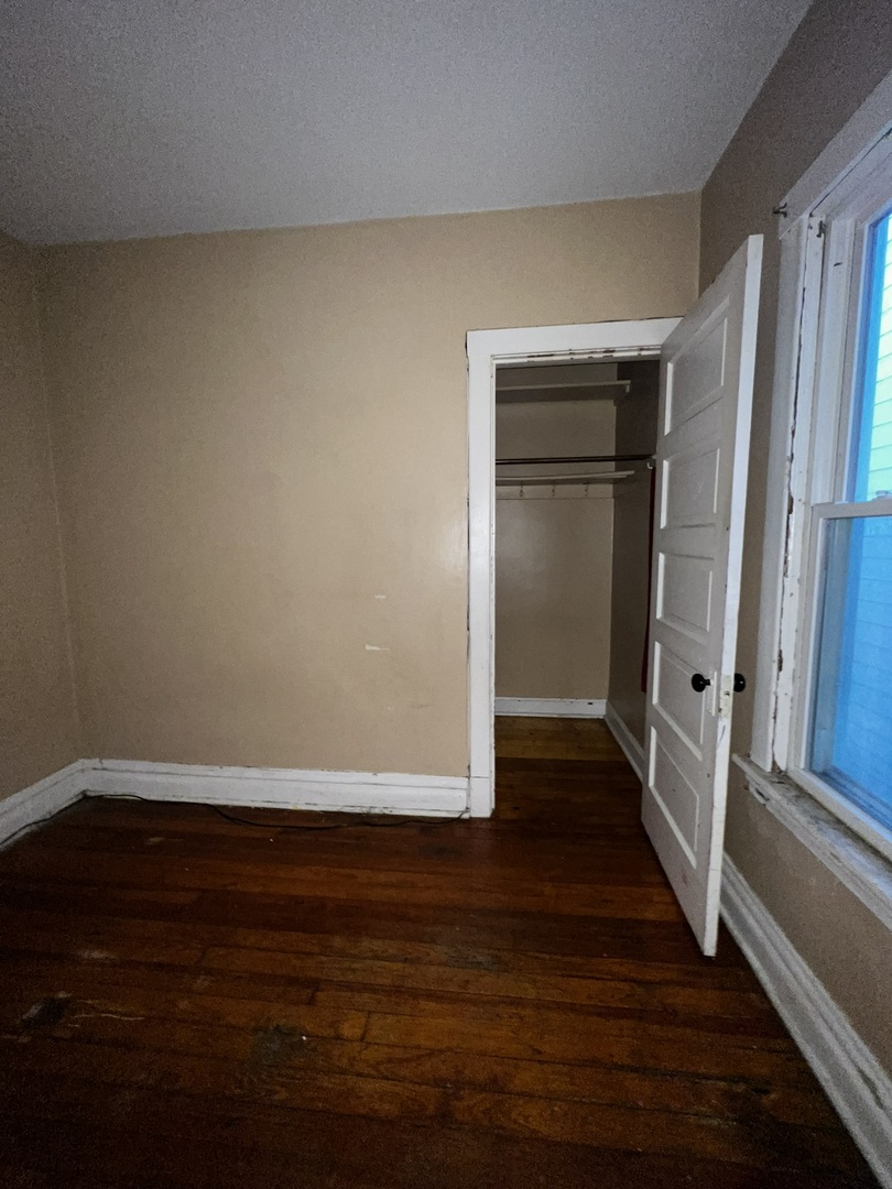 1511 Greenleaf Street Evanston, IL 60202 - Photo 32 of 37 a view of an empty room with wooden floor and window