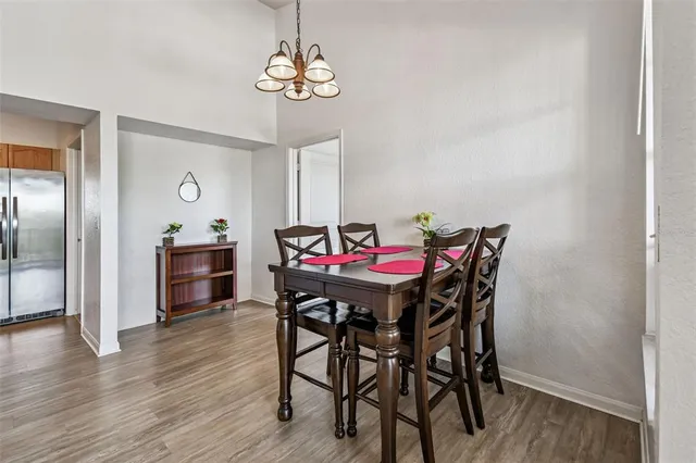 an aerial view of a house with a yard and lake view