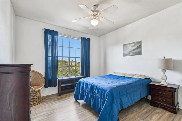 a view of a house with backyard sitting area and swimming pool