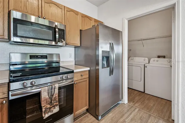 an aerial view of a house with garden space and street view