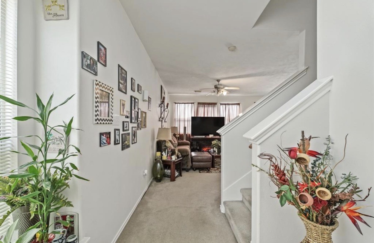 13134 Peppergate Lane Houston, TX 77044 - Photo 4 of 23 a view of a living room with a potted plant