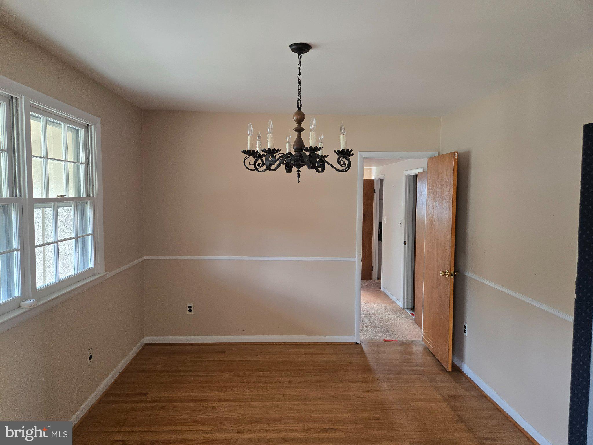 402 Georgetown Road Blackwood, NJ 08012 - Photo 8 of 11 an empty room with wooden floor a ceiling fan and windows