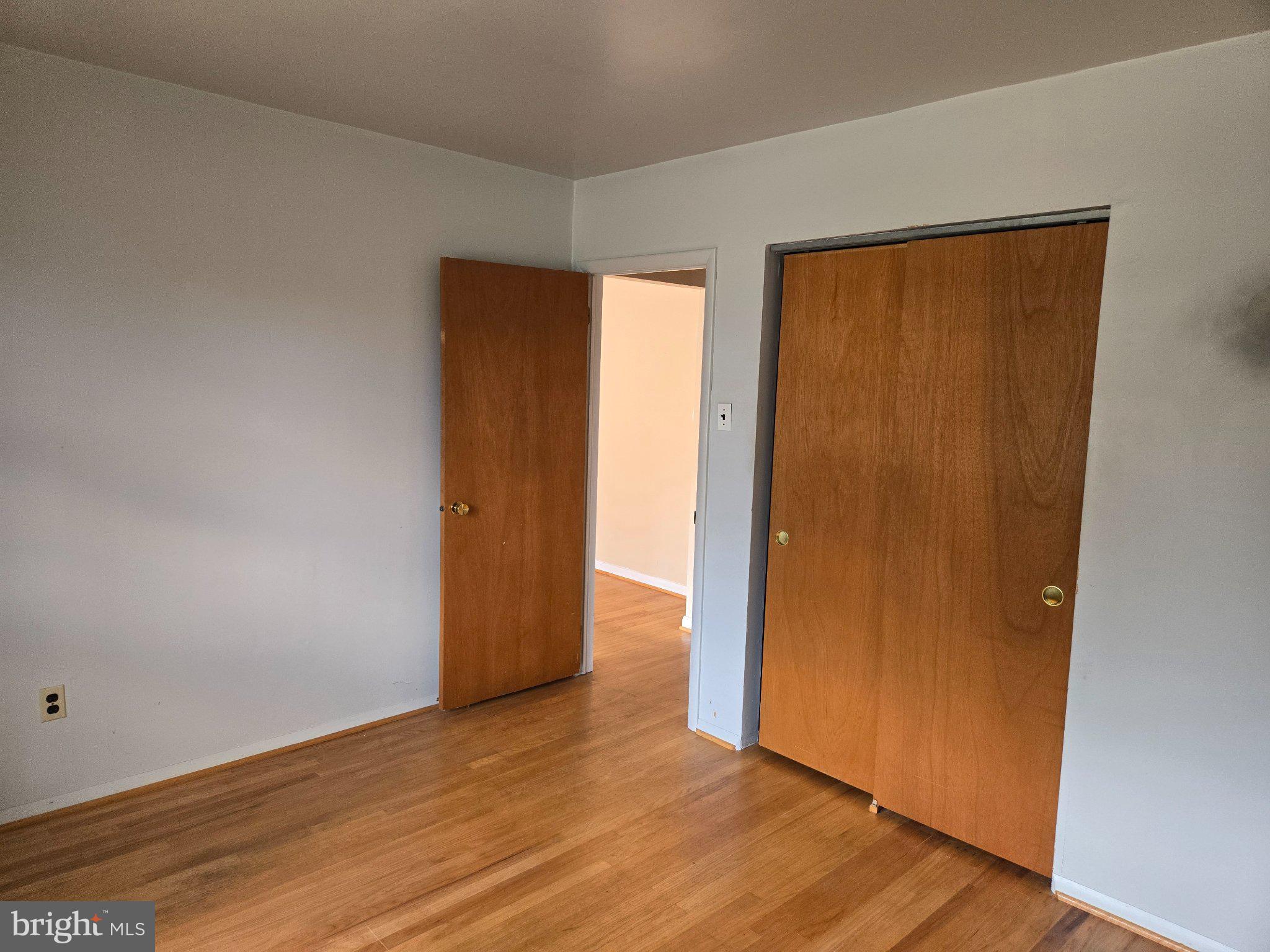 402 Georgetown Road Blackwood, NJ 08012 - Photo 9 of 11 an empty room with wooden floor and a window
