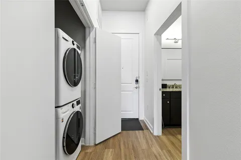 a view of a storage & utility room with a washer dryer