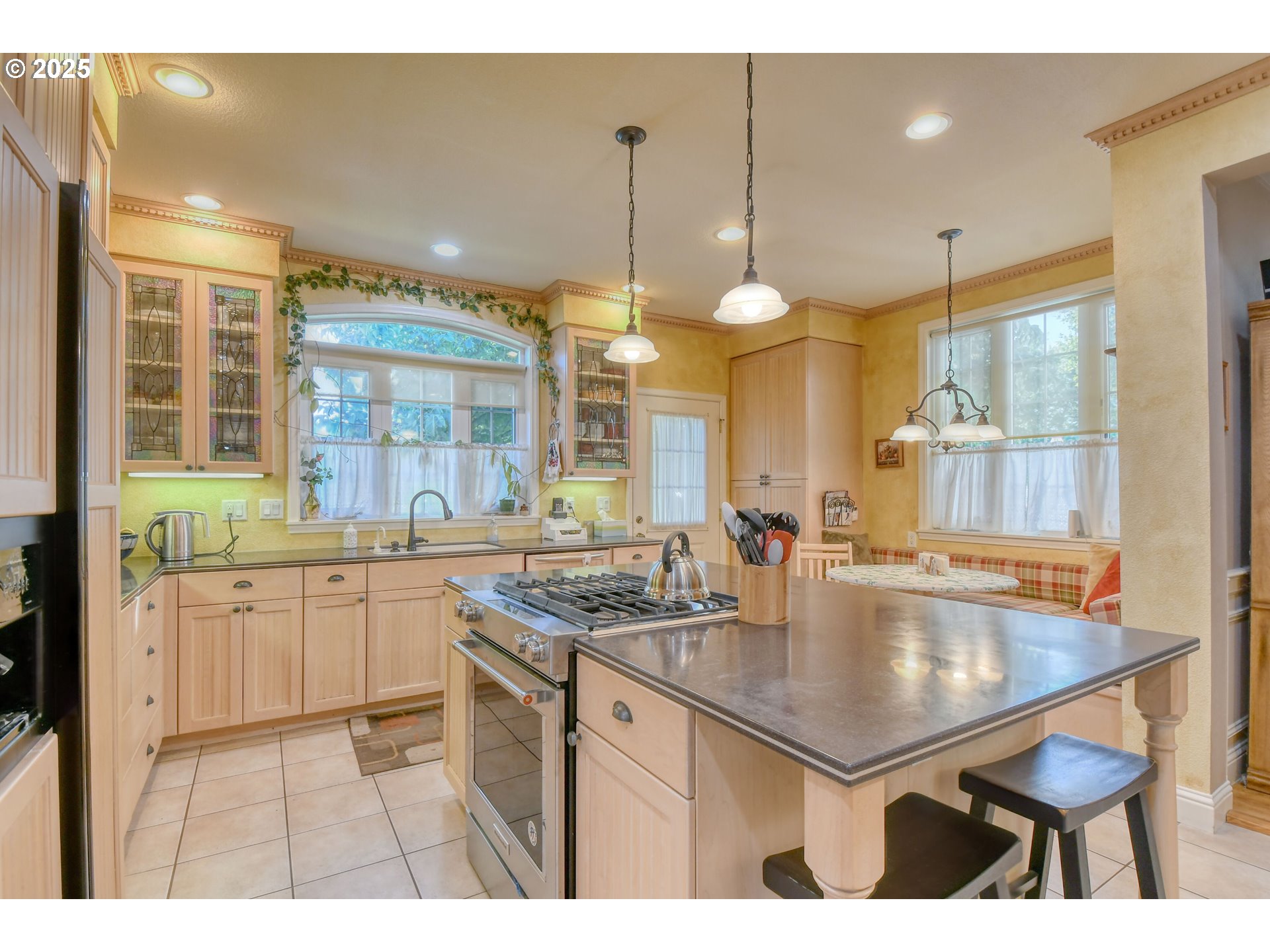 310 East Washington Street Athena, OR 97813 - Photo 13 of 45 a kitchen with center island table and chairs