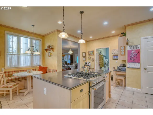 a open kitchen with stainless steel appliances granite countertop a sink stove and refrigerator