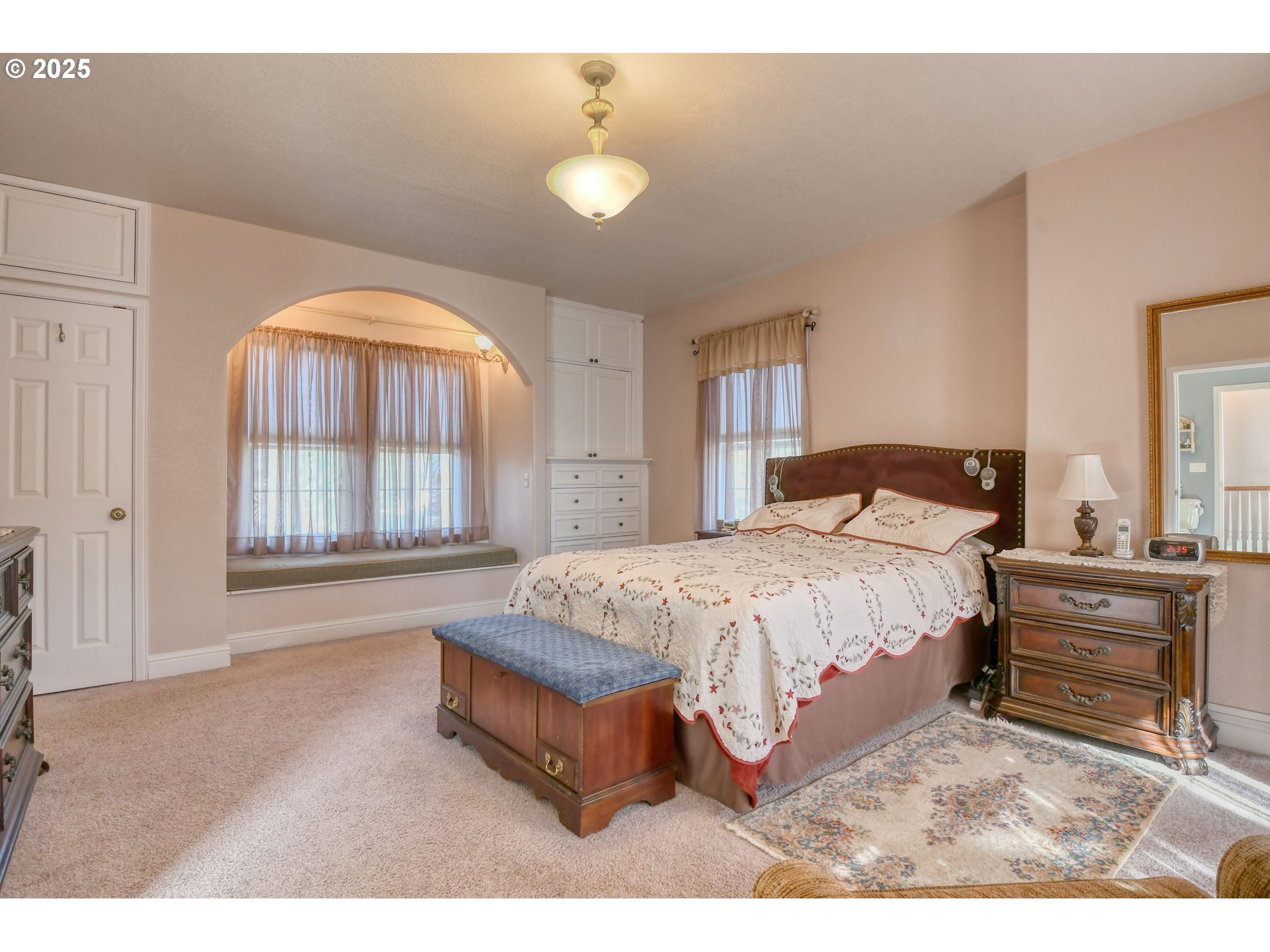 310 East Washington Street Athena, OR 97813 - Photo 17 of 45 a spacious bedroom with a bed and a dresser