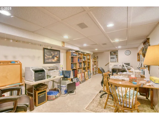 a living room with lots of furniture and a flat screen tv