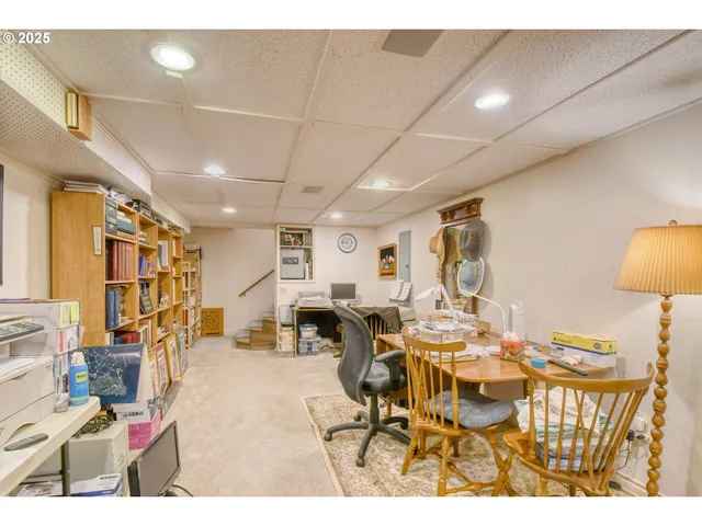 a living room with lots of furniture and a view of dining table