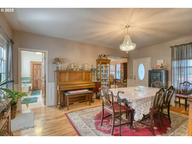 a dining room with furniture and window