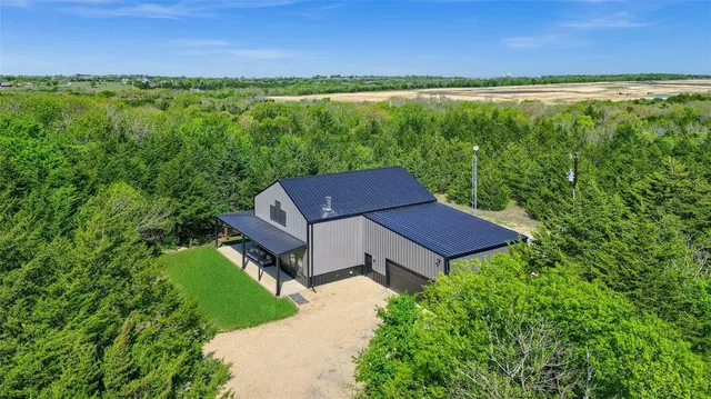 a view of a yard with a table and a lake view