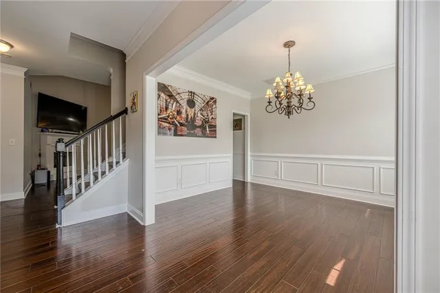 a view of an entryway with wooden floor