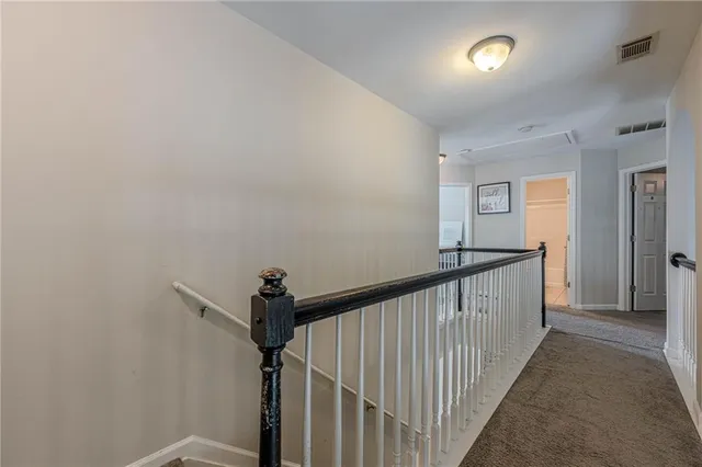 a view of a hallway view with staircase