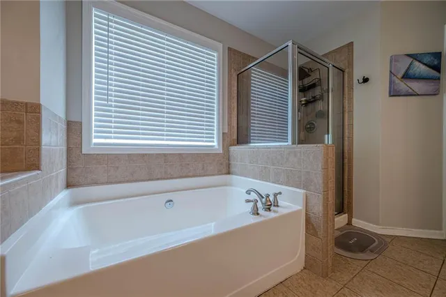 a spacious bathroom with a granite countertop sink mirror and double