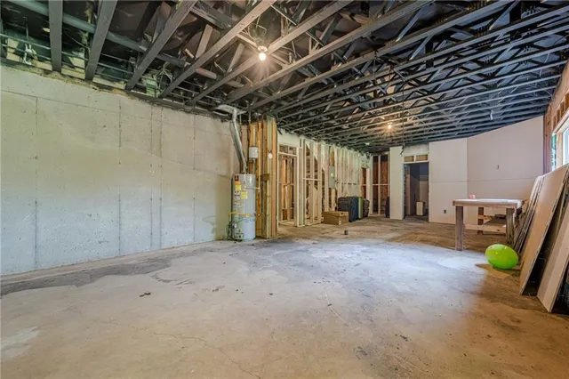 a balcony with wooden floor and trees