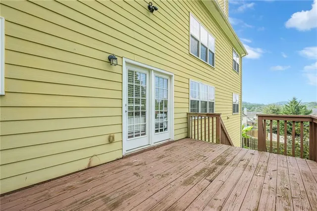 a view of a yard with wooden floor