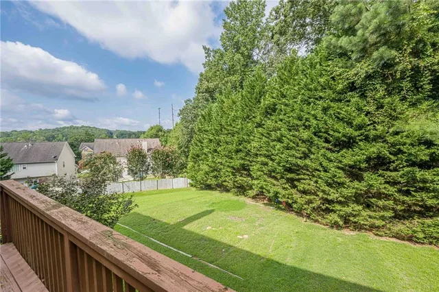 a view of a garden with a building