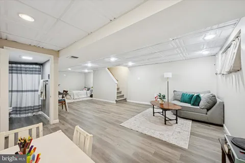 a living room with furniture and a table