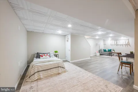 a bedroom with a bed and a table