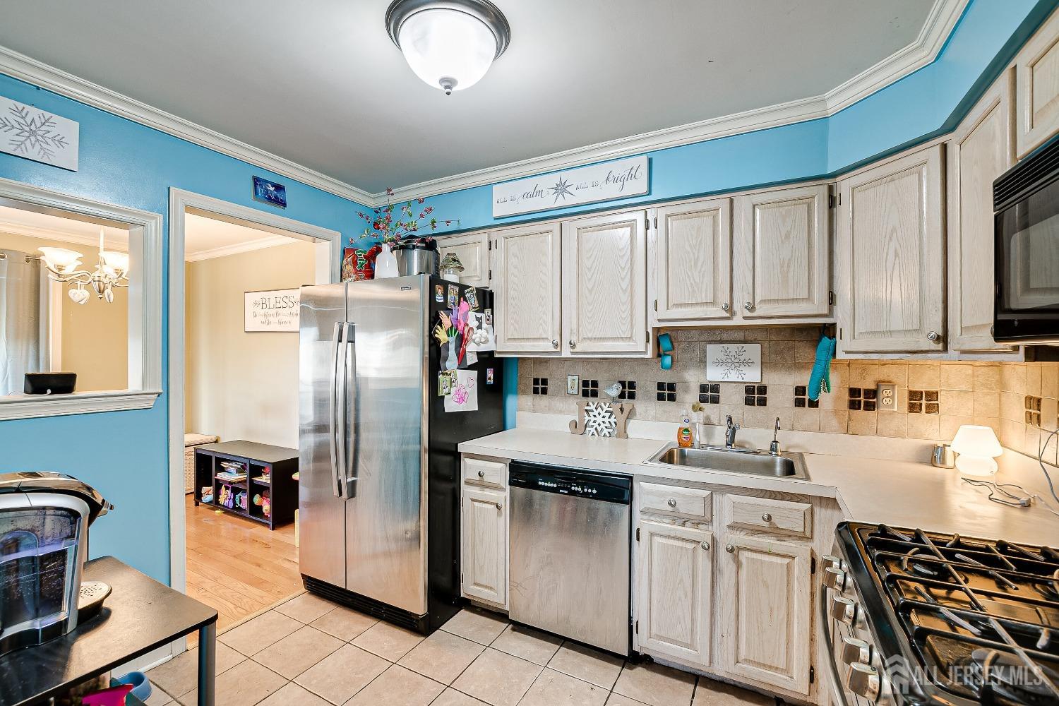 409 North Lafayette Road, Unit 409 Metuchen, NJ 08840 - Photo 11 of 24 a kitchen with stainless steel appliances granite countertop a refrigerator sink and cabinets