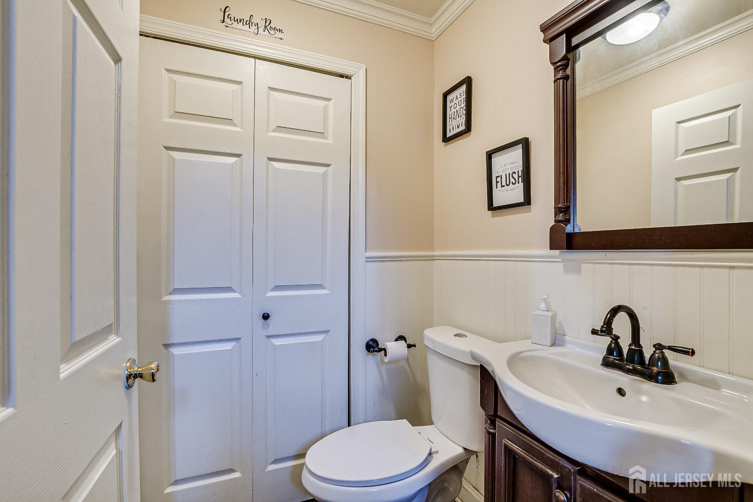 409 North Lafayette Road, Unit 409 Metuchen, NJ 08840 - Photo 14 of 24 a bathroom with a sink mirror and toilet