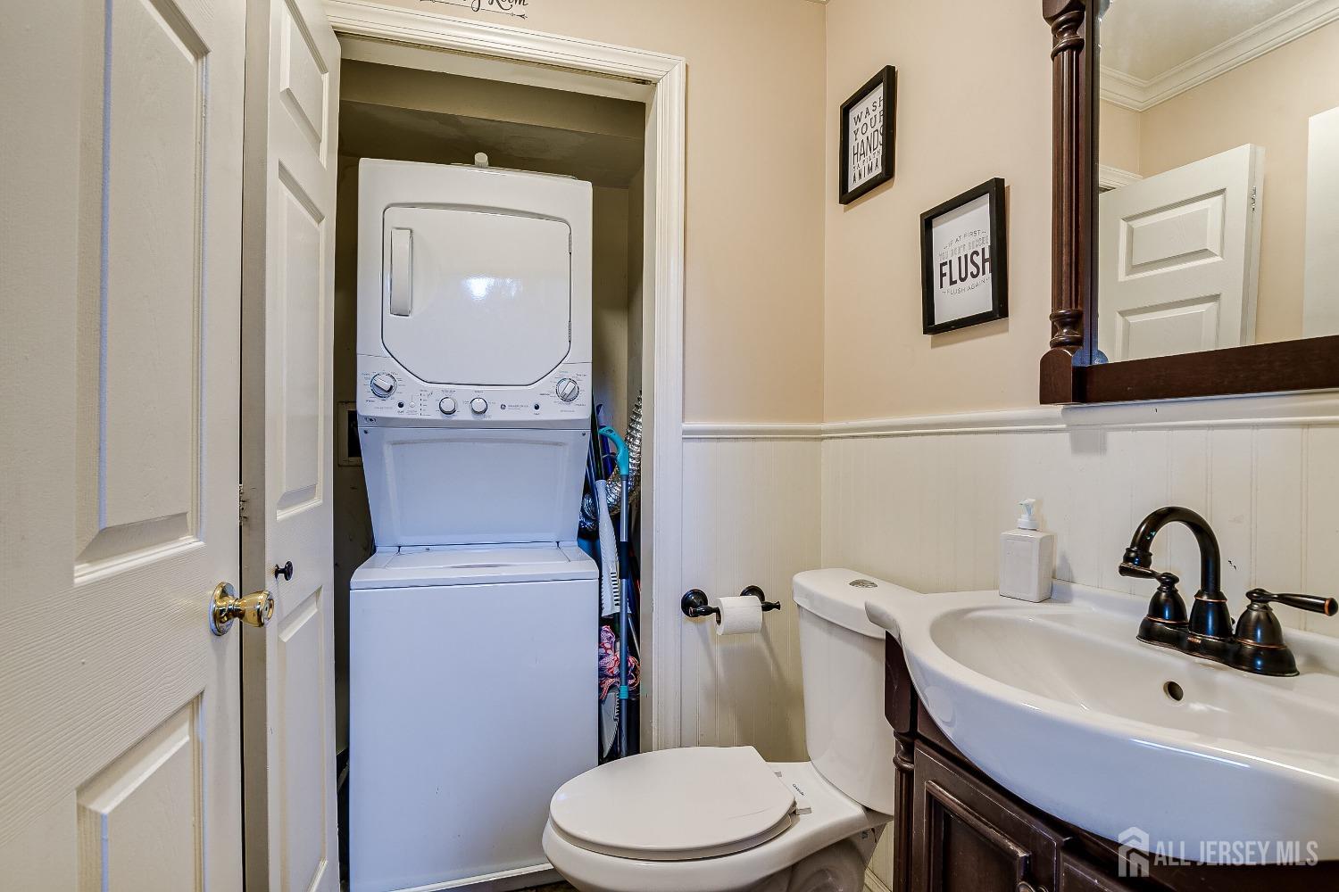 409 North Lafayette Road, Unit 409 Metuchen, NJ 08840 - Photo 15 of 24 a bathroom with a toilet a sink and mirror