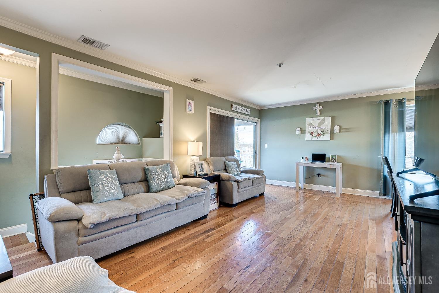 409 North Lafayette Road, Unit 409 Metuchen, NJ 08840 - Photo 3 of 24 a living room with furniture and a wooden floor