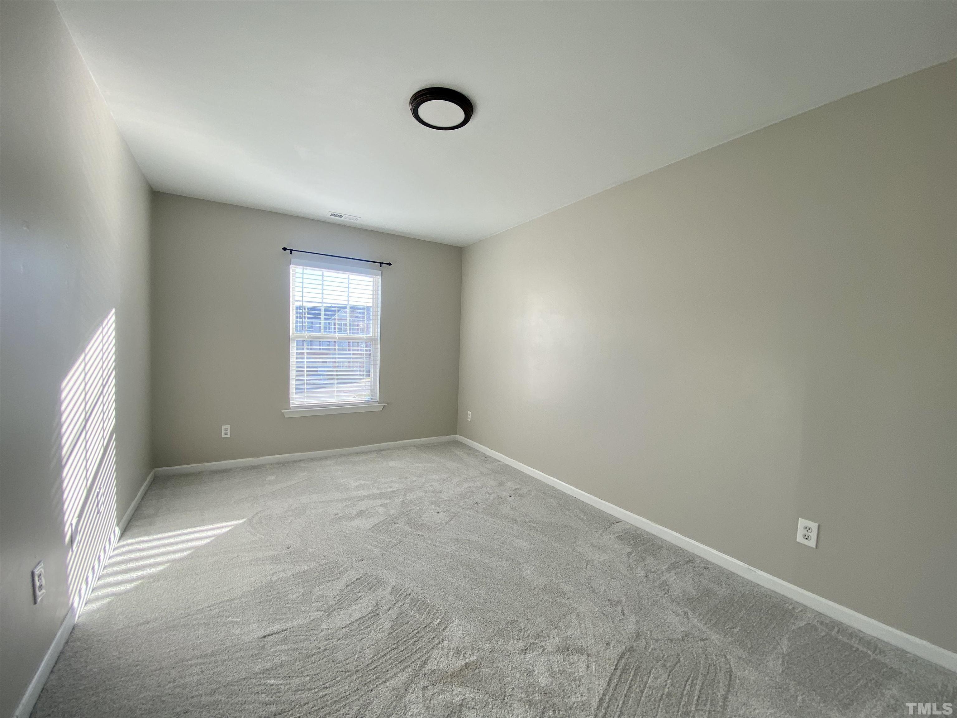 2225 Raven Road, Unit 108 Raleigh, NC 27614 - Photo 20 of 26 an empty room with windows