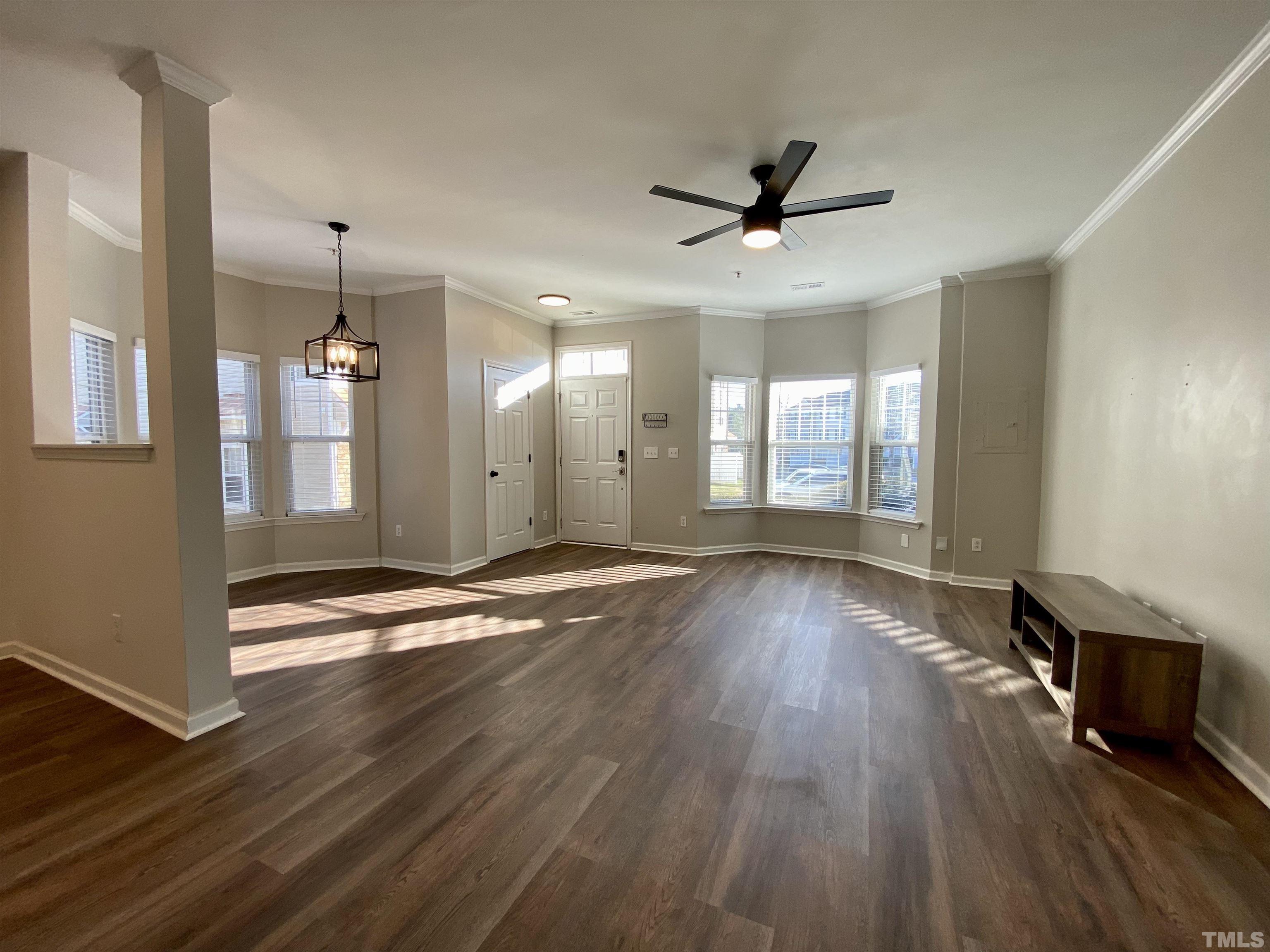 2225 Raven Road, Unit 108 Raleigh, NC 27614 - Photo 7 of 26 a view of an empty room with wooden floor and a window