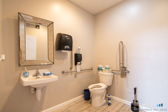 113 School Street Killingly, CT 06239 - Photo 9 of 33 a bathroom with a sink toilet and mirror