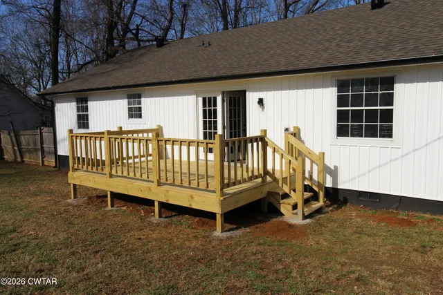 an outdoor sitting area with chairs