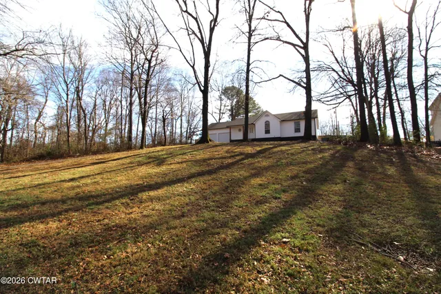 a house with trees in front of it