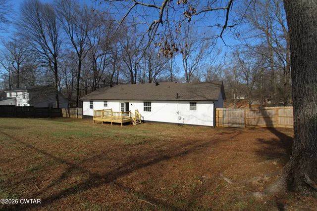 a view of a yard with a tree