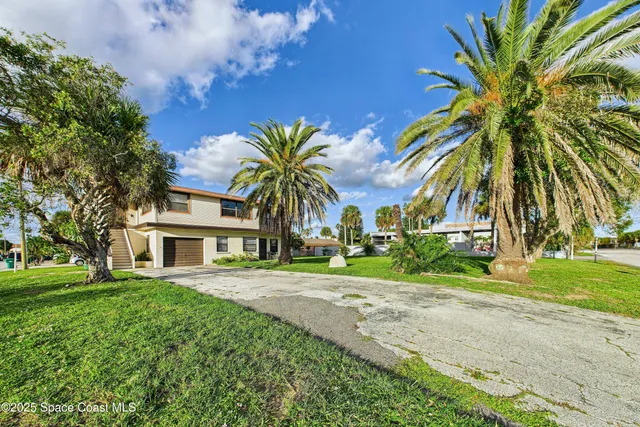 a house view with a garden space