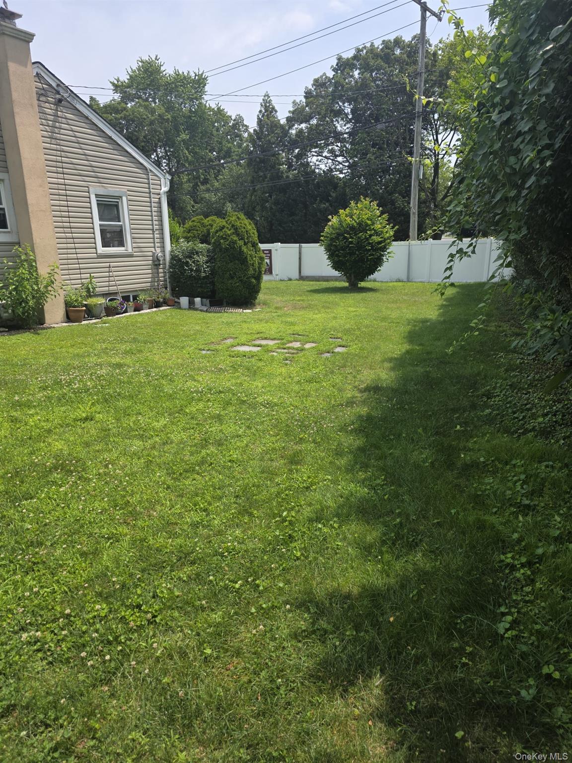 23 Seaman Neck Road Dix Hills, NY 11746 - Photo 11 of 12 a view of a house with backyard